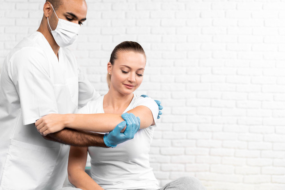 male-physiotherapist-checking-woman-s-shoulder-with-copy-space.jpg