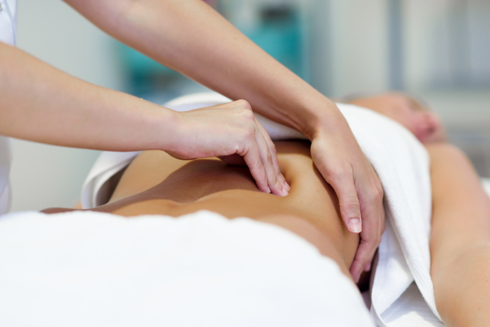 woman-having-abdomen-massage-by-professional-osteopathy-therapist.jpg